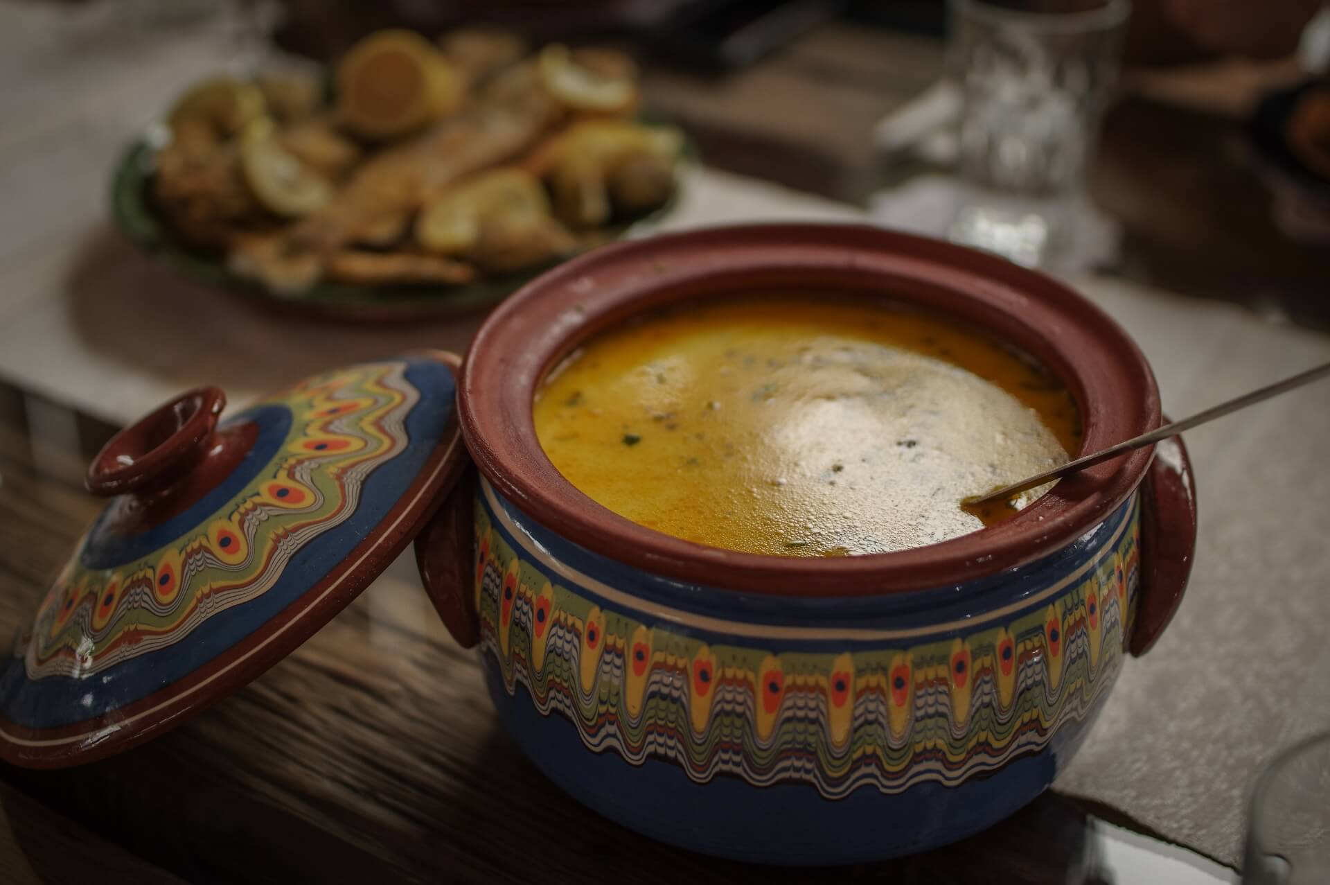 Traditional borsch in a ceramic bowl as part of Biovaleputna guest house cuisine